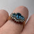 Blue Topaz Trilogy & Diamond Halo Ring 18ct Yellow Gold  - Size K