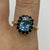 Blue Topaz & Sapphire Halo Cluster Ring 9ct 9k Yellow Gold - Size P 1/2