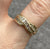 CZ Channel Set Twist Crossover Ring 9ct 9k Yellow Gold - Size O