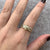 Diamond .10ct Baguette Twist Knot Crossover Ring 9ct Yellow Gold - Size N 1/2